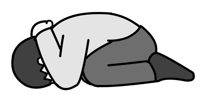 かがんでいる人